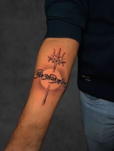 Fine line script and compass cross forearm tattoo — Undertone Tattoos Mohali