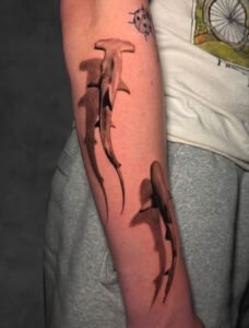 Fresh red thorn branch tattoo on thigh — Undertone Tattoos Mohali
